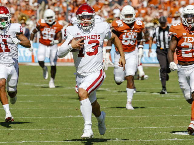 DALLAS, TX - OCTOBER 09: Oklahoma Sooners quarterback Caleb Williams (13) runs for a touchdown during the Red River Showdown between the Texas Longhorns and the Oklahoma Sooners on October 09, 2021 at the Cotton Bowl in Dallas, Texas.