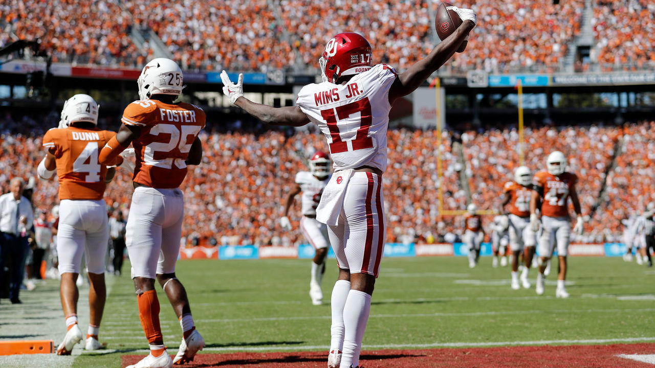 DALLAS, TEXAS - OCTOBER 09: Marvin Mims #17 of the Oklahoma Sooners reacts after a touchdown reception in the fourth quarter against the Texas Longhorns during the 2021 AT&T Red River Showdown at Cotton Bowl on October 09, 2021 in Dallas, Texas.