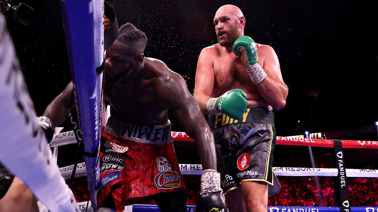 LAS VEGAS, NEVADA - OCTOBER 09: Deontay Wilder (L) is knocked out by Tyson Fury in the 11th round during their WBC heavyweight title fight at T-Mobile Arena on October 09, 2021 in Las Vegas, Nevada.