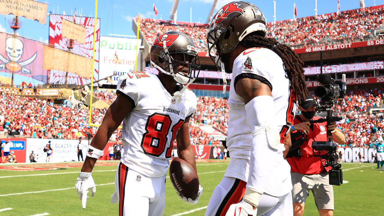 TAMPA, FLORIDA - OCTOBER 10: Antonio Brown #81 of the Tampa Bay Buccaneers celebrates a touchdown with Richard Sherman #5 during the second quarter against the Miami Dolphins at Raymond James Stadium on October 10, 2021 in Tampa, Florida.