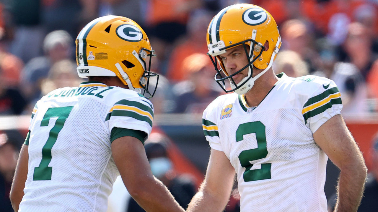 CINCINNATI, OHIO - OCTOBER 10: Mason Crosby #2 of the Green Bay Packers celebrates with Corey Bojorquez #7 after a successful kick during the second quarter against the Cincinnati Bengals at Paul Brown Stadium on October 10, 2021 in Cincinnati, Ohio.