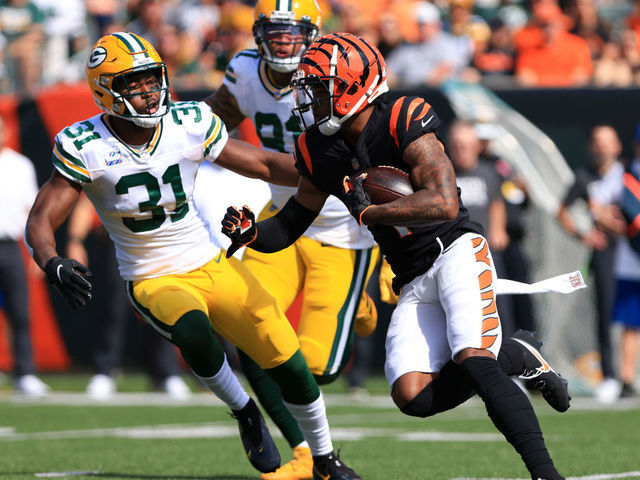 CINCINNATI, OH - OCTOBER 10: Cincinnati Bengals wide receiver Ja'Marr Chase (1) carries the ball during the game against the Green Bay Packers and the Cincinnati Bengals on October 10, 2021, at Paul Brown Stadium in Cincinnati, OH.