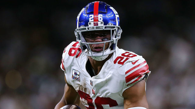 NEW ORLEANS, LOUISIANA - OCTOBER 03: Saquon Barkley #26 of the New York Giants runs with the ball against the New Orleans Saints during a game at the Caesars Superdome on October 03, 2021 in New Orleans, Louisiana.