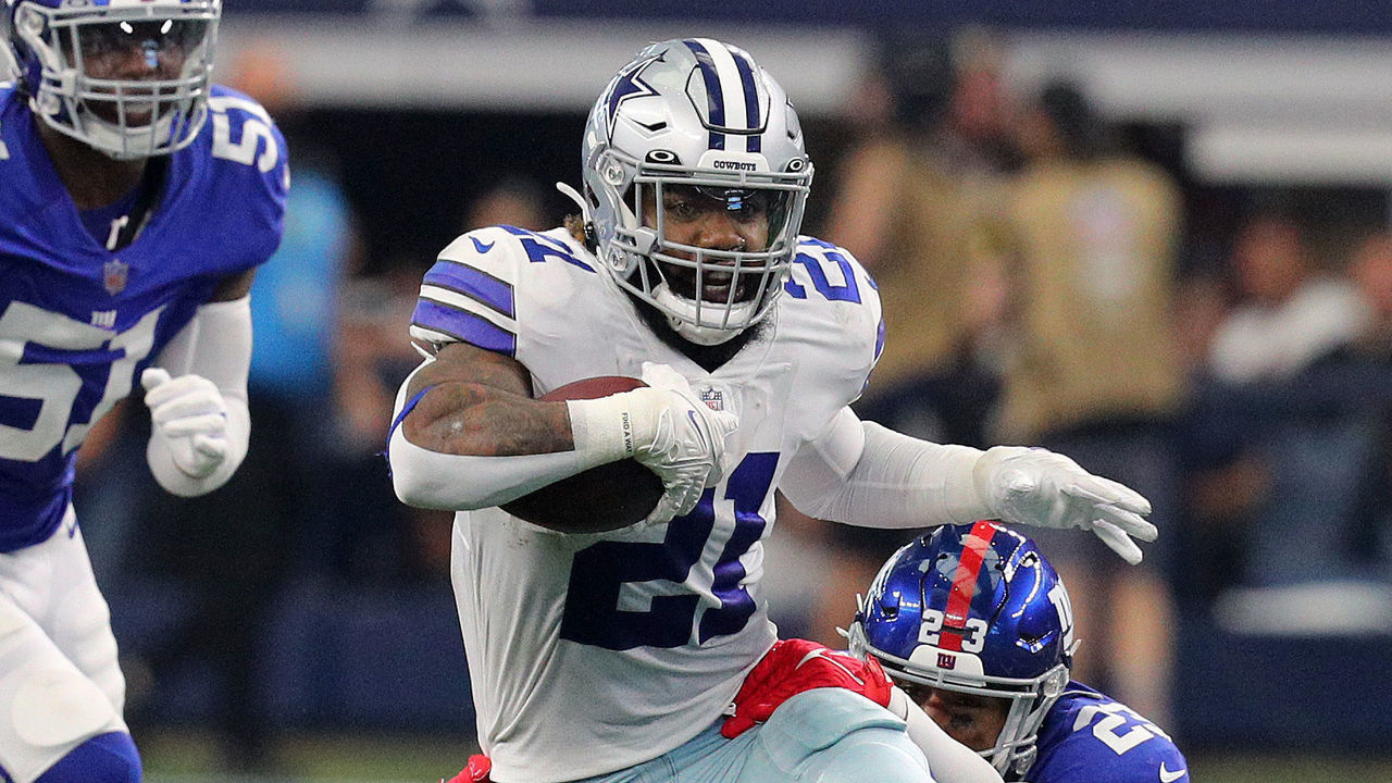 ARLINGTON, TEXAS - OCTOBER 10: Ezekiel Elliott #21 of the Dallas Cowboys runs the ball during the first half against the New York Giants at AT&T Stadium on October 10, 2021 in Arlington, Texas.