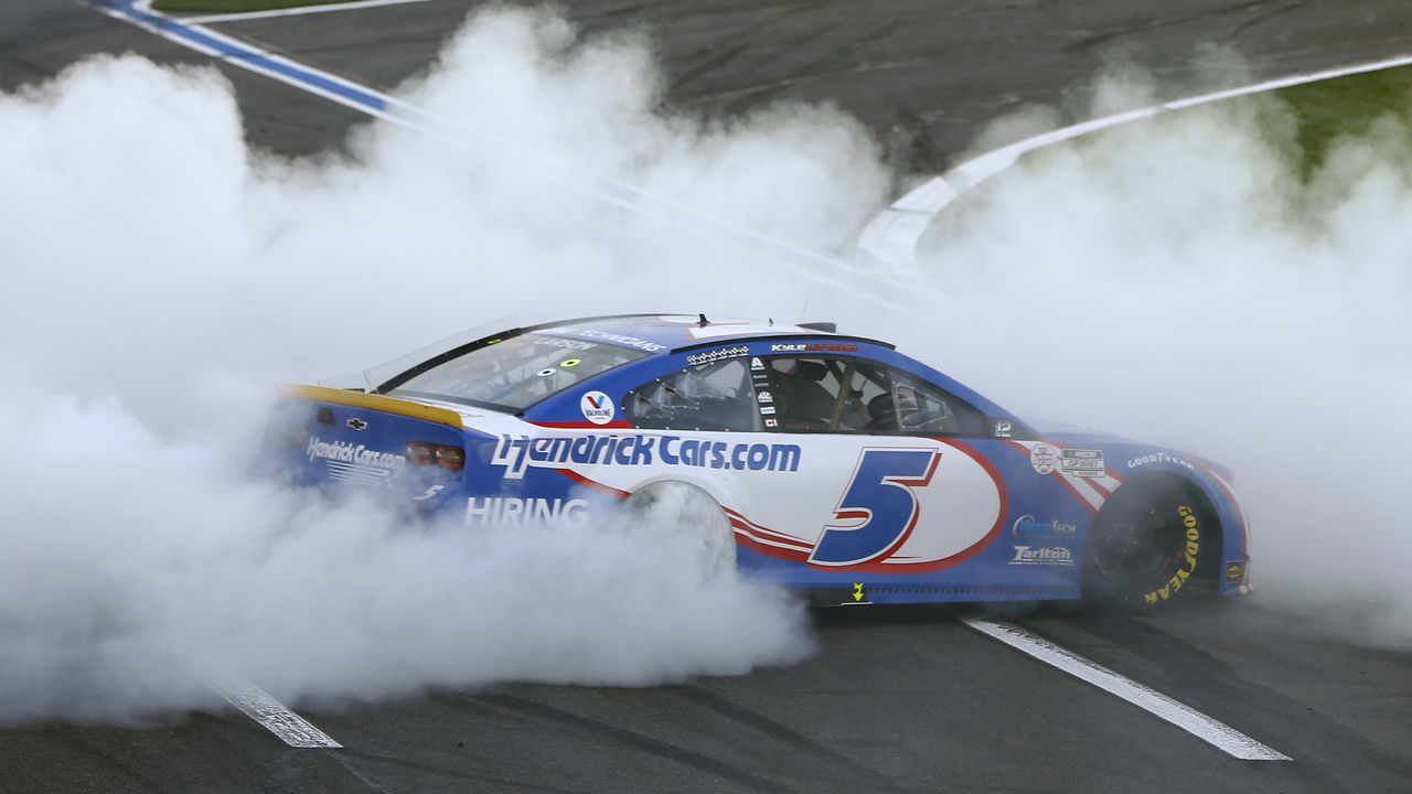 CONCORD, NORTH CAROLINA - OCTOBER 10: Kyle Larson, driver of the #5 HendrickCars.com Chevrolet, celebrates with a burnout after winning the NASCAR Cup Series Bank of America ROVAL 400 at Charlotte Motor Speedway on October 10, 2021 in Concord, North Carolina.