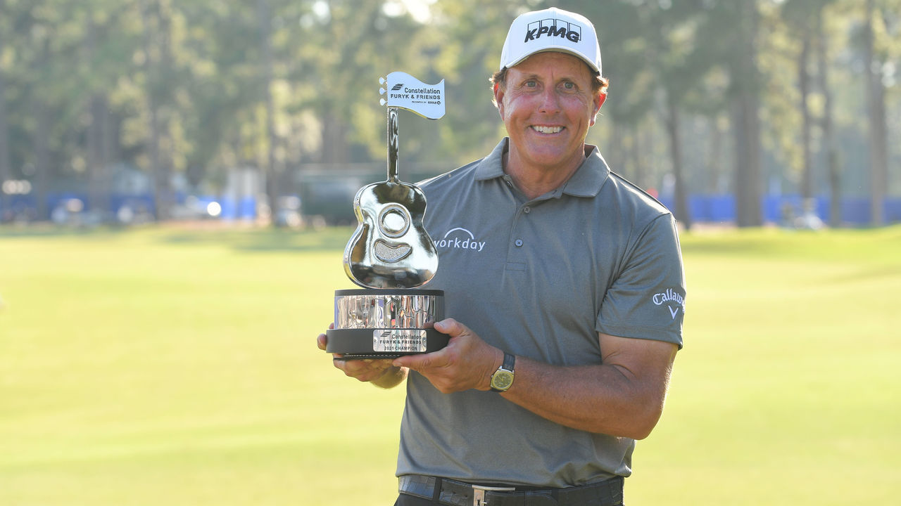 PONTE VEDRA BEACH - OCTOBER 10: Phil Mickelson holds the trophy on the 18th green after the final round of the PGA TOUR Champions Constellation FURYK & FRIENDS presented by Circle K at Timuquana Country Club on October 10, 2021 in Jacksonville, Florida.