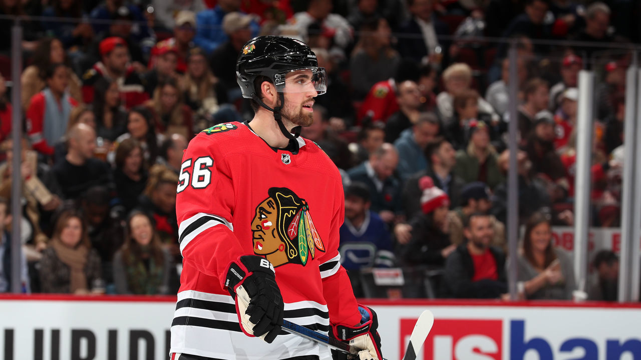CHICAGO, IL - NOVEMBER 07: Erik Gustafsson #56 of the Chicago Blackhawks looks down the ice in the second period against the Vancouver Canucks at the United Center on November 7, 2019 in Chicago, Illinois. The Chicago Blackhawks defeated the Vancouver Canucks 5-2.