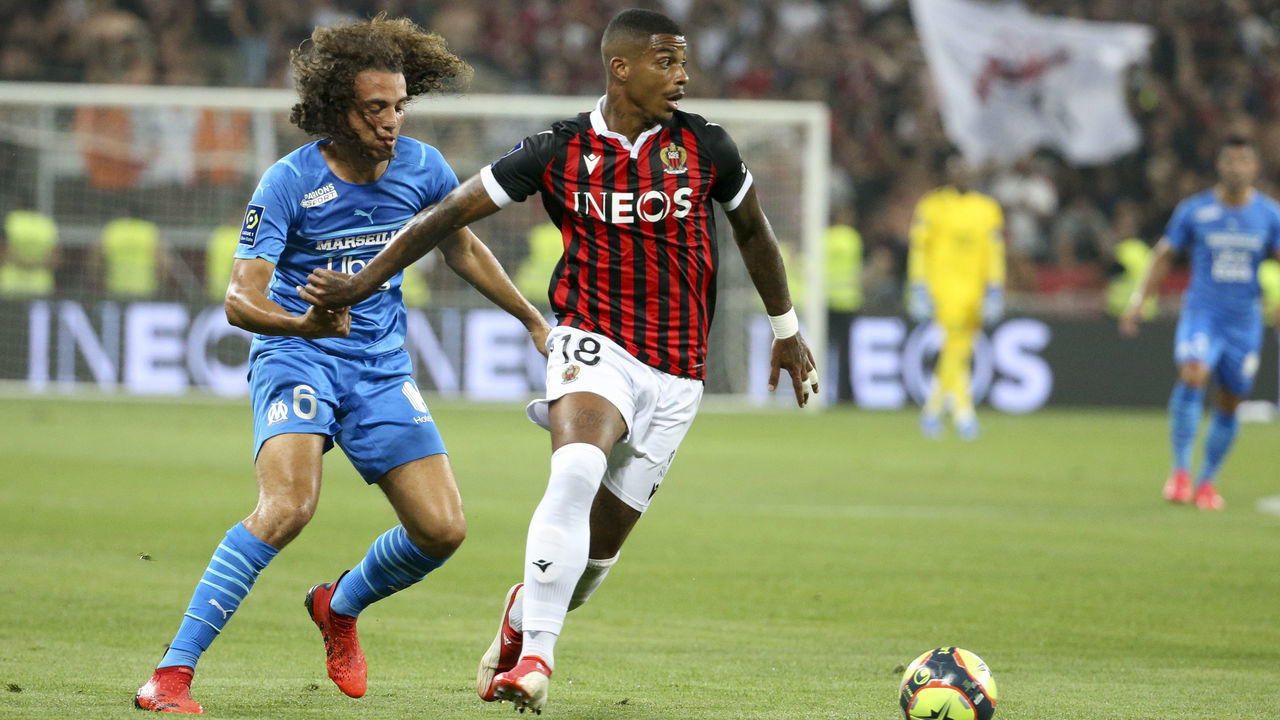 NICE, FRANCE - AUGUST 22: Mario Lemina of Nice, Matteo Guendouzi of Marseille (left) during the Ligue 1 match between OGC Nice (OGCN) and Olympique de Marseille (OM) at Allianz Riviera Stadium on August 22, 2021 in Nice, France.