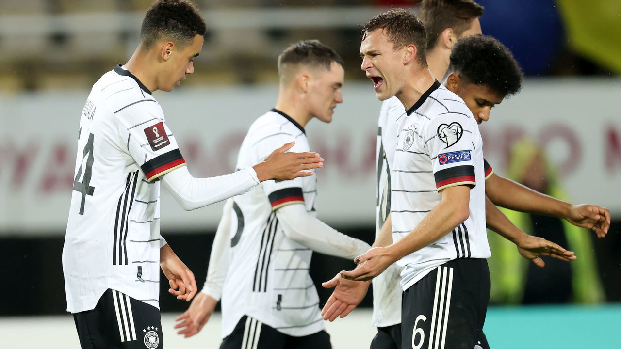 SKOPJE, MACEDONIA - OCTOBER 11: Jamal Musiala of Germany celebrates with Joshua Kimmich after scoring their team's fourth goal during the 2022 FIFA World Cup Qualifier match between North Macedonia and Germany at National Arena Todor Proeski on October 11, 2021 in Skopje, Macedonia.