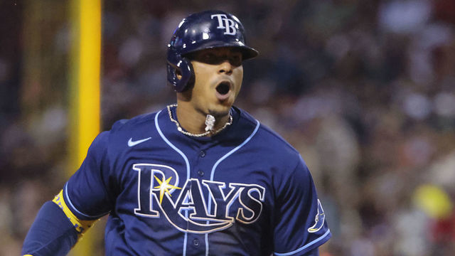 Boston - October 10: Tampa Bay Rays shortstop Wander Franco (5) hits a solo home run against the Boston Red Sox during the eighth inning. The Boston Red Sox host the Tampa Bay Rays in Game 3 of the ALDS at Fenway Park in Boston on Oct. 10, 2021.