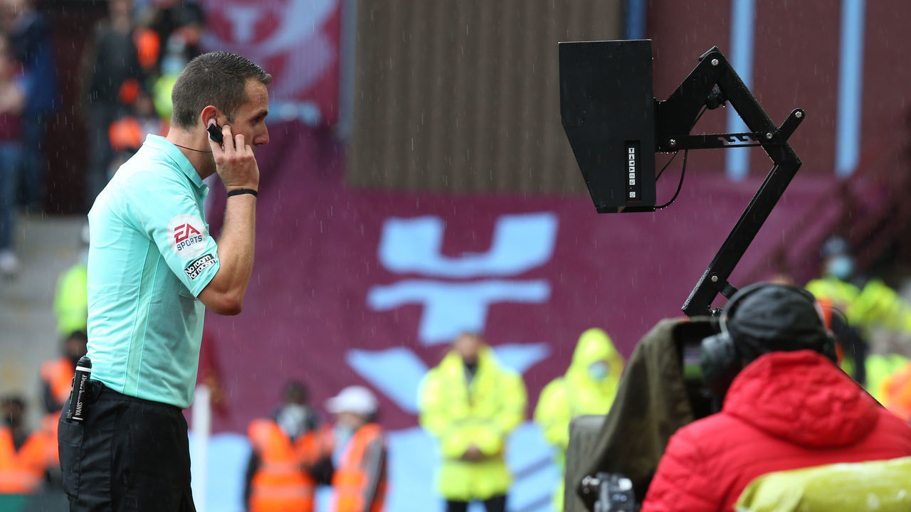 BIRMINGHAM, ENGLAND - AUGUST 21: referee David Coote checks the monitor for a VAR decision during the Premier League match between Aston Villa and Newcastle United at Villa Park on August 21, 2021 in Birmingham, England.