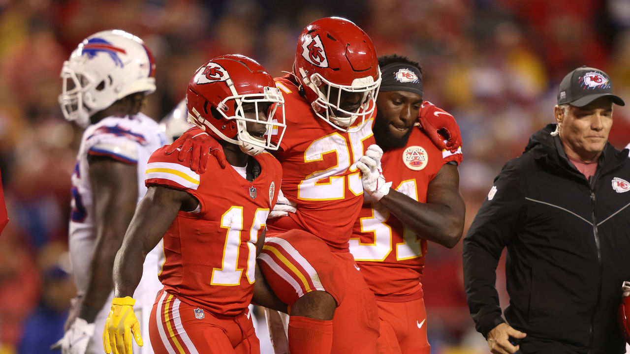 KANSAS CITY, MISSOURI - OCTOBER 10: Charvarius Ward #35 and Tyreek Hill #10 help Clyde Edwards-Helaire #25 of the Kansas City Chiefs off the field after he was injured during the second half of a game against the Buffalo Bills at Arrowhead Stadium on October 10, 2021 in Kansas City, Missouri.