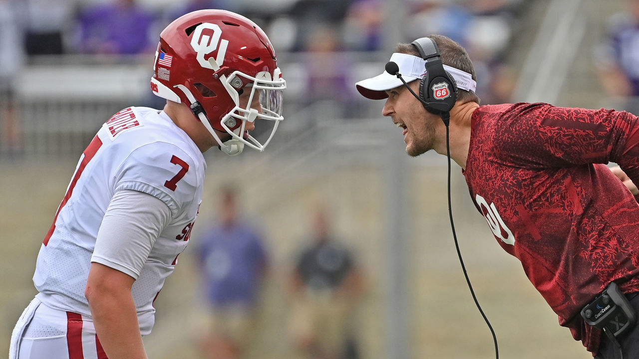 MANHATTAN, KS - OCTOBER 02: Head coach Lincoln Riley (R) of the Oklahoma Sooners give instructions to quarterback Spencer Rattler #7, during the first half against the Kansas State Wildcats at Bill Snyder Family Football Stadium on October 2, 2021 in Manhattan, Kansas.