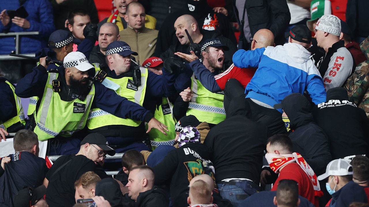 LONDON, ENGLAND - OCTOBER 12: Police clash with Hungary fans during the 2022 FIFA World Cup Qualifier match between England and Hungary at Wembley Stadium on October 12, 2021 in London, England.