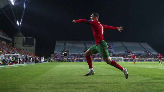 FARO, PORTUGAL - OCTOBER 12: Cristiano Ronaldo of Manchester United and Portugal celebrates scoring Portugal's fifth goal and his third in the match during the 2022 FIFA World Cup Qualifier match between Portugal and Luxembourg at Estadio Algarve on October 12, 2021 in Faro, Faro.