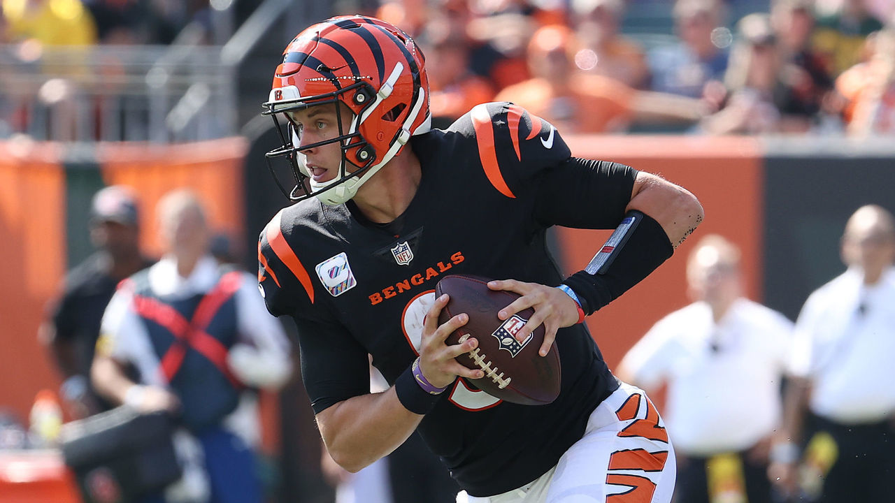 CINCINNATI, OHIO - OCTOBER 10: Joe Burrow #9 of the Cincinnati Bengals runs with the ball against the Green Bay Packers at Paul Brown Stadium on October 10, 2021 in Cincinnati, Ohio.