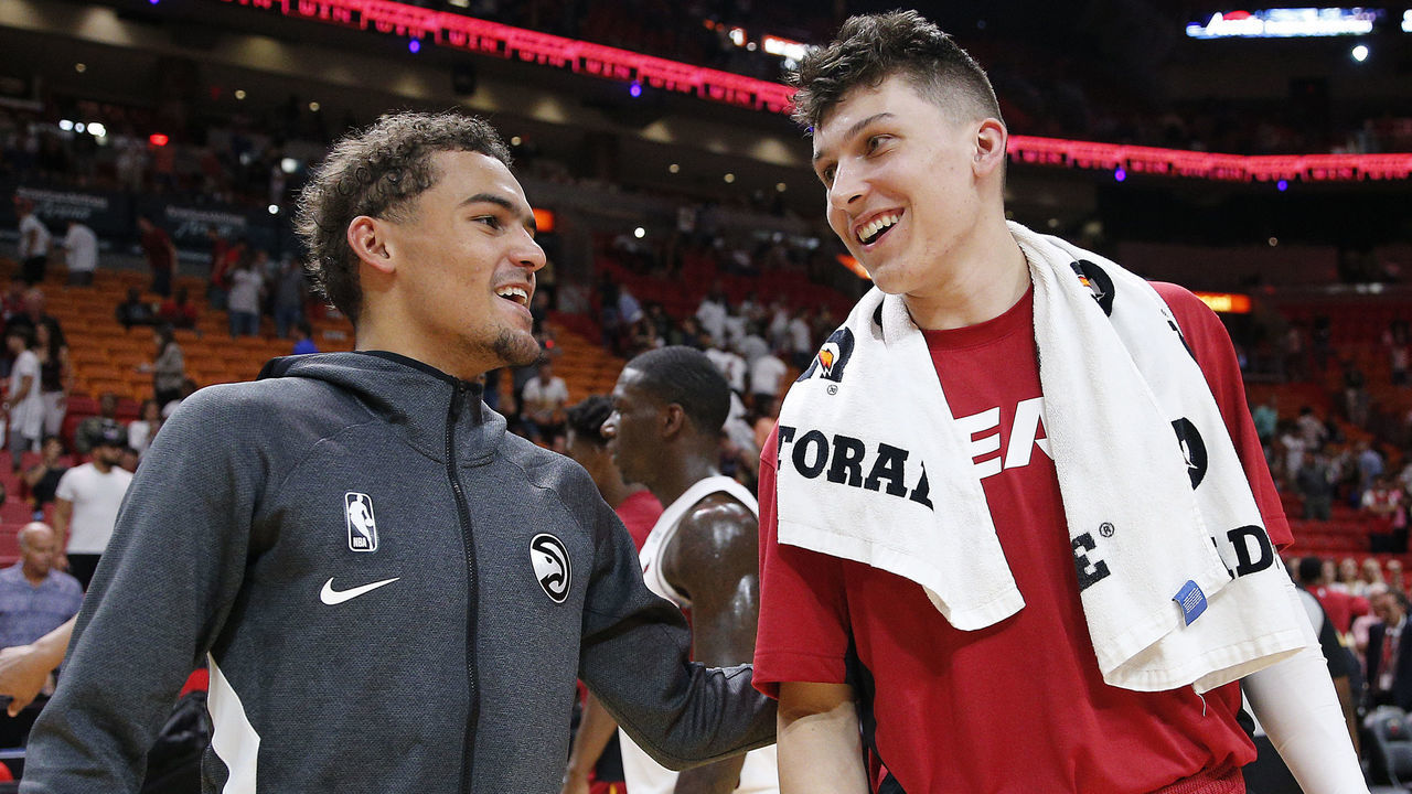 MIAMI, FLORIDA - OCTOBER 14: Trae Young #11 of the Atlanta Hawks talks with Tyler Herro #14 of the Miami Heat after the preseason game at American Airlines Arena on October 14, 2019 in Miami, Florida.
