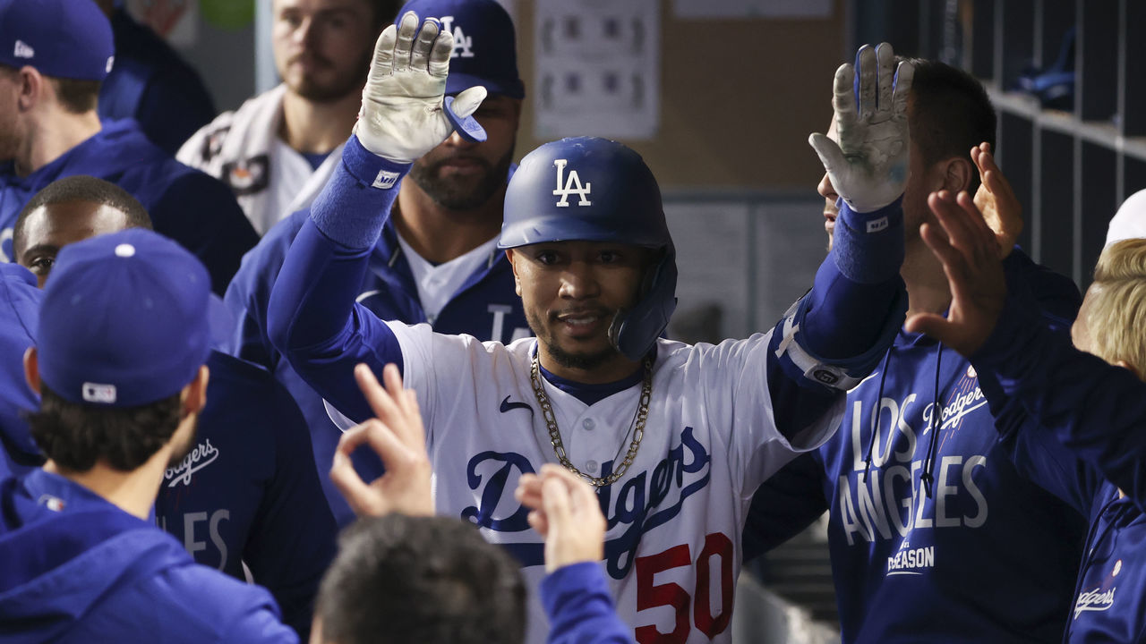 Los Angeles, CA - October 12: Los Angeles Dodgers' Mookie Betts celebrates with the dugout after a sacrifice fly that scored Cody Bellinger during the fifth inning in game four of the 2021 National League Division Series against the San Francisco Giants at Dodger Stadium on Tuesday, Oct. 12, 2021 in Los Angeles, CA. (Robert Gauthier / Los Angeles Times via Getty Images)