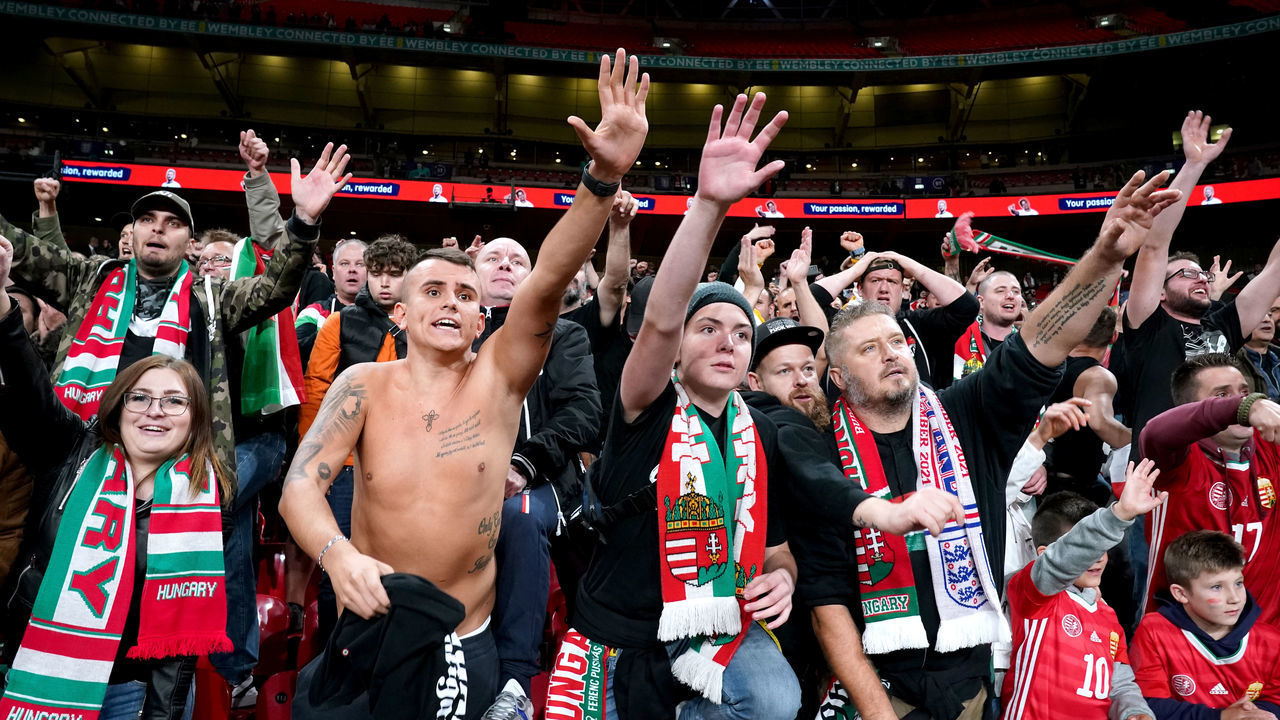 Hungary fans gesture for players shirts at the end of the FIFA World Cup Qualifying match at Wembley Stadium, London. Picture date: Tuesday October 12, 2021.