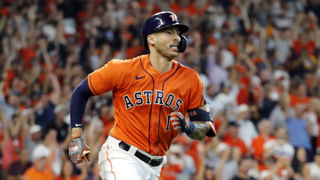 HOUSTON, TEXAS - OCTOBER 08: Carlos Correa #1 of the Houston Astros hits a 2-run double during the 7th inning of Game 2 of the American League Division Series against the Chicago White Sox at Minute Maid Park on October 08, 2021 in Houston, Texas.