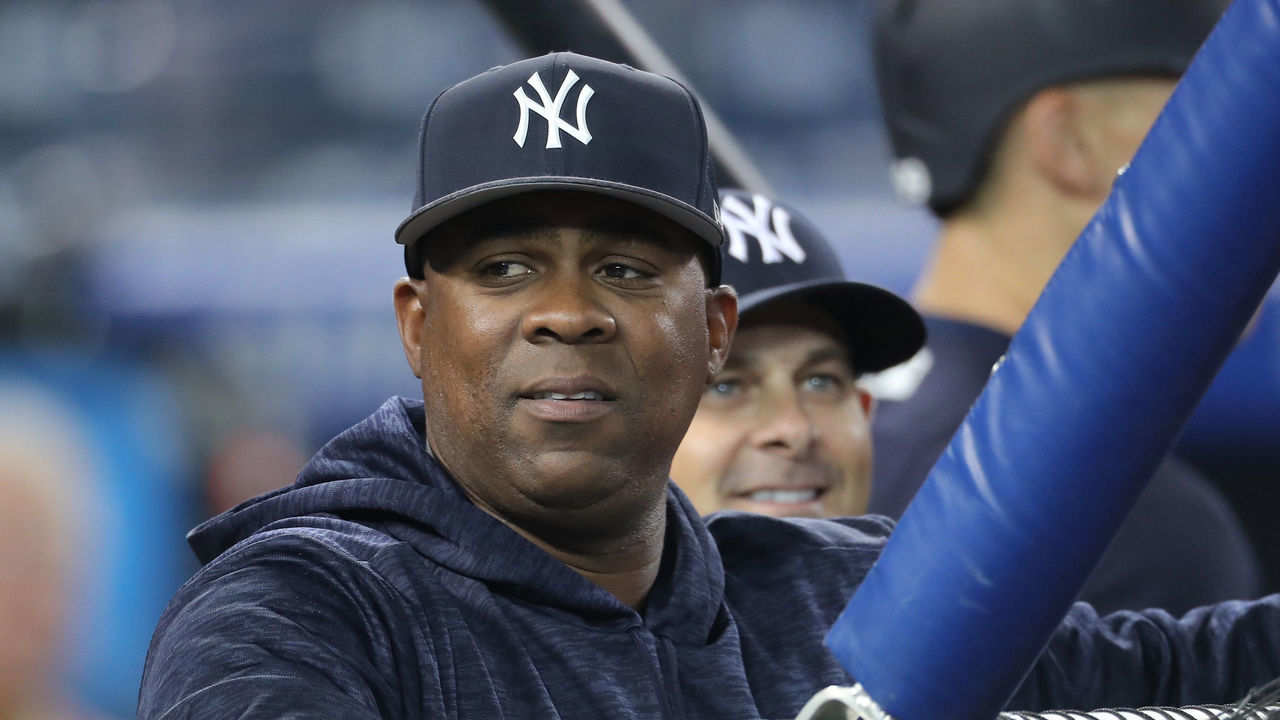 TORONTO, ON - MARCH 30: Hitting coach Marcus Thames #63 (L) of the New York Yankees and manager Aaron Boone #17 look on during batting practice before the start of MLB game action against the Toronto Blue Jays at Rogers Centre on March 30, 2018 in Toronto, Canada. *** Local Caption *** Aaron Boone;Marcus Thames