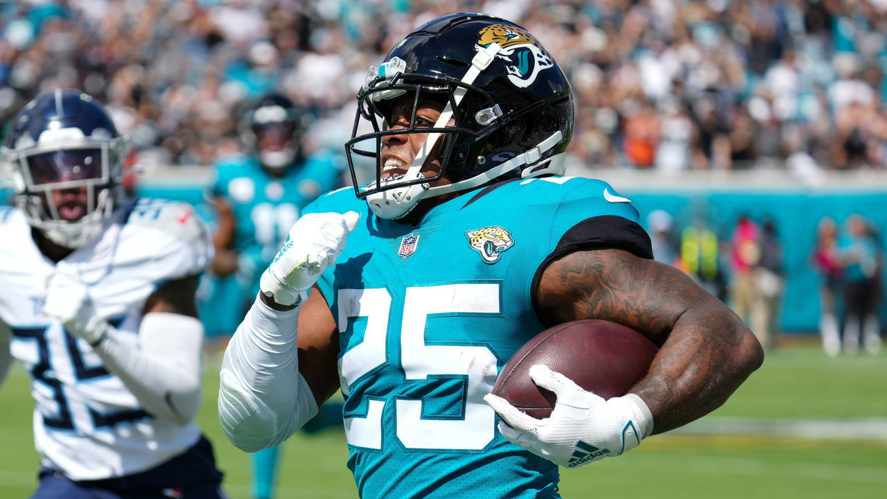 JACKSONVILLE, FLORIDA - OCTOBER 10: James Robinson #25 of the Jacksonville Jaguars runs with the ball during the first quarter against the Tennessee Titans at TIAA Bank Field on October 10, 2021 in Jacksonville, Florida.