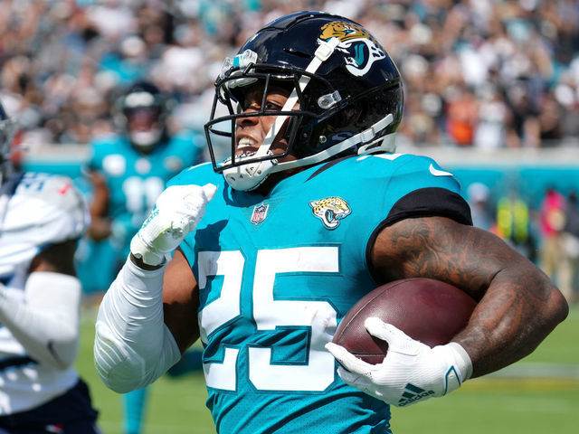 JACKSONVILLE, FLORIDA - OCTOBER 10: James Robinson #25 of the Jacksonville Jaguars runs with the ball during the first quarter against the Tennessee Titans at TIAA Bank Field on October 10, 2021 in Jacksonville, Florida.