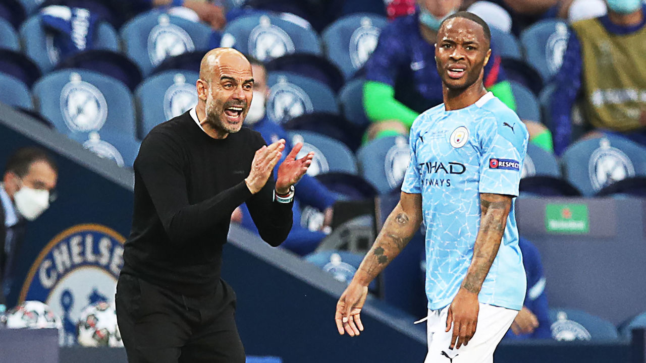 Manchester City's Spanish coach Josep Guardiola (L) and Manchester City's English forward Raheem Sterling react during the UEFA Champions League final football match between Manchester City and Chelsea FC at the Dragao stadium in Porto on May 29, 2021.