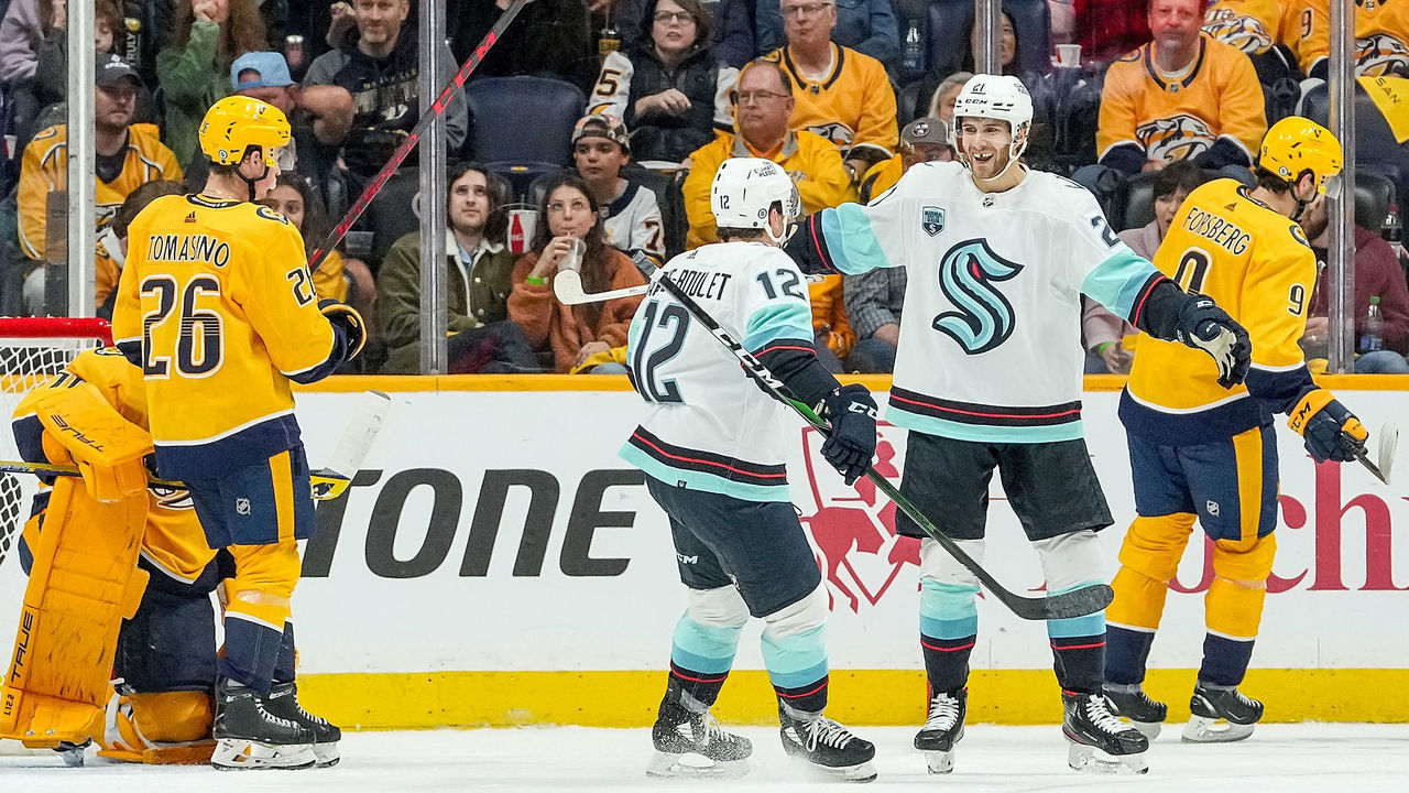 NASHVILLE, TN - OCTOBER 14: Alex Wennberg #21 celebrates his goal with Alex Barré-Boulet #12 of the Seattle Kraken against the Nashville Predators during an NHL game at Bridgestone Arena on October 14, 2021 in Nashville, Tennessee.