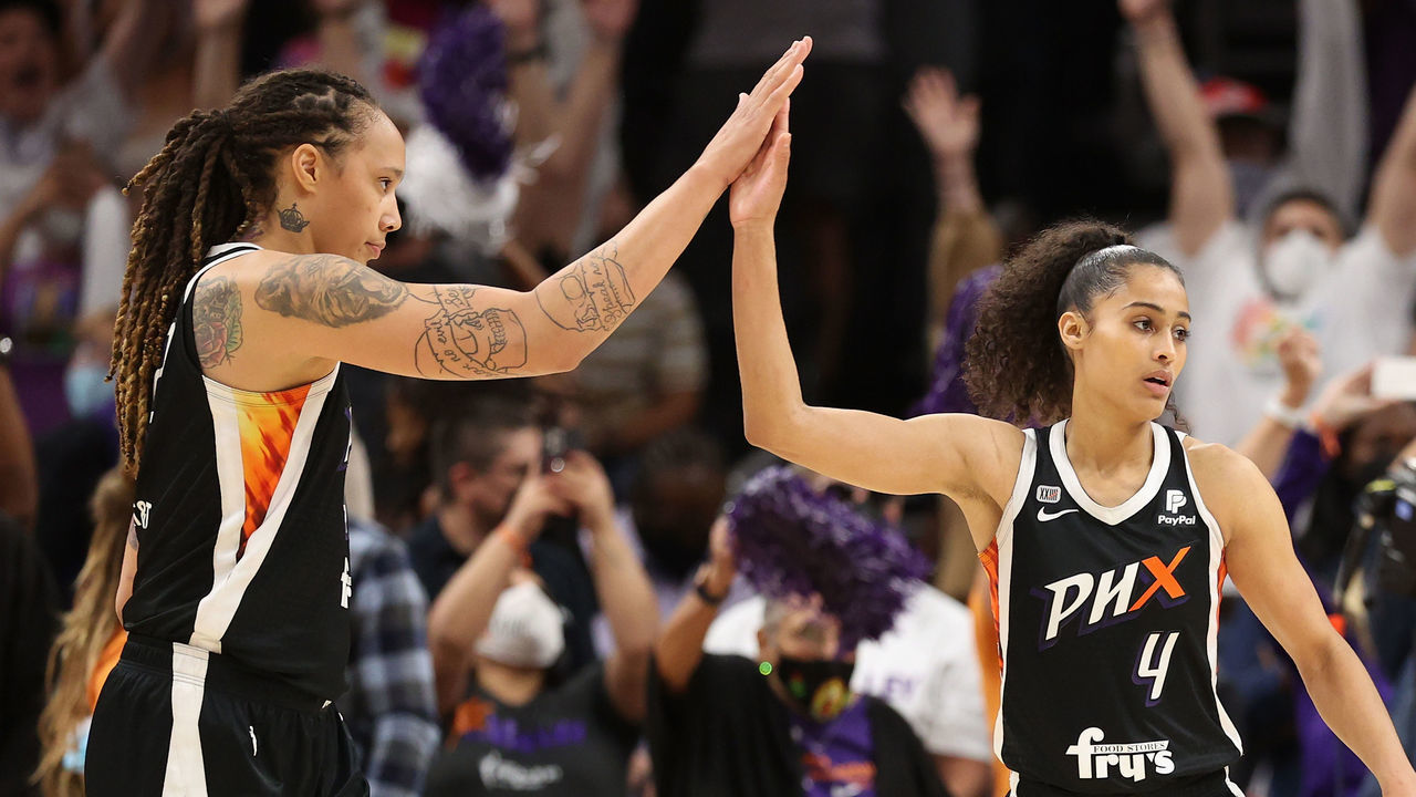 PHOENIX, ARIZONA - OCTOBER 13: Brittney Griner #42 and Skylar Diggins-Smith #4 of the Phoenix Mercury celebrate after defeating the Chicago Sky in Game Two of the 2021 WNBA Finals at Footprint Center on October 13, 2021 in Phoenix, Arizona. The Mercury defeated the Sky 91-86 in overtime.