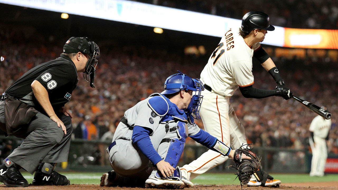 SAN FRANCISCO, CALIFORNIA - OCTOBER 14: Wilmer Flores #41 of the San Francisco Giants strikes out on a checked swing for the final out of the game against the Los Angeles Dodgers during the ninth inning in game 5 of the National League Division Series at Oracle Park on October 14, 2021 in San Francisco, California. The Los Angeles Dodgers beat the San Francisco Giants 2-1.
