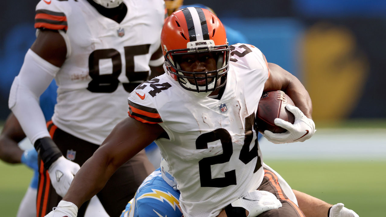 INGLEWOOD, CALIFORNIA - OCTOBER 10: Nick Chubb #24 of the Cleveland Browns runs as he is tackled by Drue Tranquill #49 of the Los Angeles Chargers during a 49-42 loss to the Los Angeles Chargers at SoFi Stadium on October 10, 2021 in Inglewood, California.