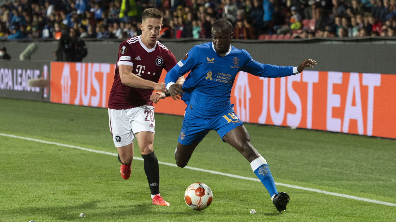 GLASGOW, SCOTLAND - SEPTEMBER 30: Rangers' Glen Kamara (right) shieds the ball from Sparta's Tomas Wiesner (left) during a UEFA Europa League group stage match between Celtic and Bayer Leverkusen at Celtic Park, on September 30, 2021, in Glasgow, Scotland.
