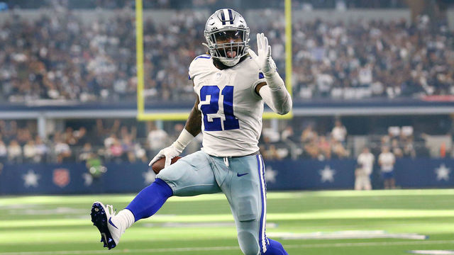 ARLINGTON, TEXAS - OCTOBER 10: Ezekiel Elliott #21 of the Dallas Cowboys celebrates as he runs the ball for a touchdown during the second half against the New York Giants at AT&T Stadium on October 10, 2021 in Arlington, Texas.
