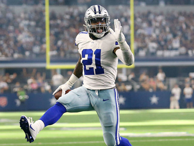 ARLINGTON, TEXAS - OCTOBER 10: Ezekiel Elliott #21 of the Dallas Cowboys celebrates as he runs the ball for a touchdown during the second half against the New York Giants at AT&T Stadium on October 10, 2021 in Arlington, Texas.