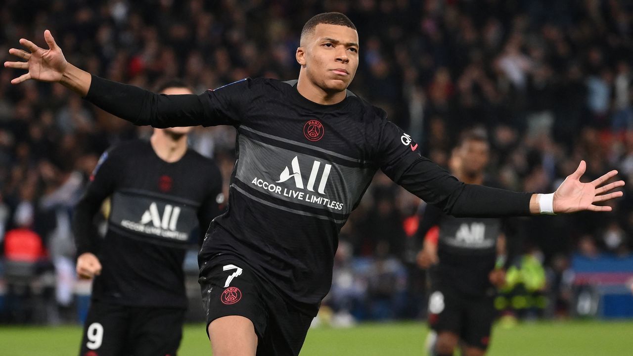 Paris Saint-Germain's French forward Kylian Mbappe celebrates after scoring a penalrty during the French L1 football match between Paris Saint-Germain (PSG) and SCO Angers at the Parc des Princes stadium in Paris on October 15, 2021.