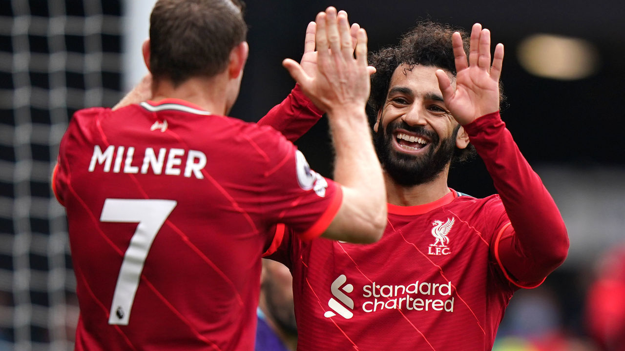 Liverpool's Mohamed Salah (right) and James Milner celebrate after Roberto Firmino scores their side's second goal of the game during the Premier League match at Vicarage Road, Watford. Picture date: Saturday October 16, 2021.