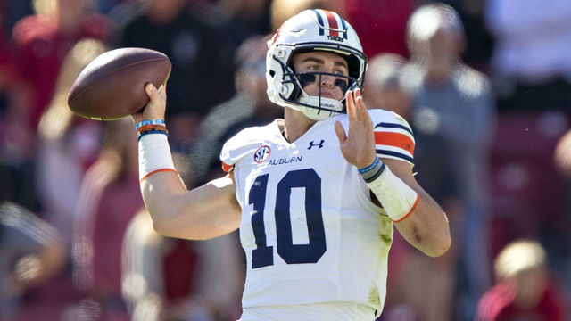FAYETTEVILLE, ARKANSAS - OCTOBER 16: Bo Nix #10 of the Auburn Tigers throws a pass in the first half during a game against the Arkansas Razorbacks at Donald W. Reynolds Razorback Stadium on October 16, 2021 in Fayetteville, Arkansas.