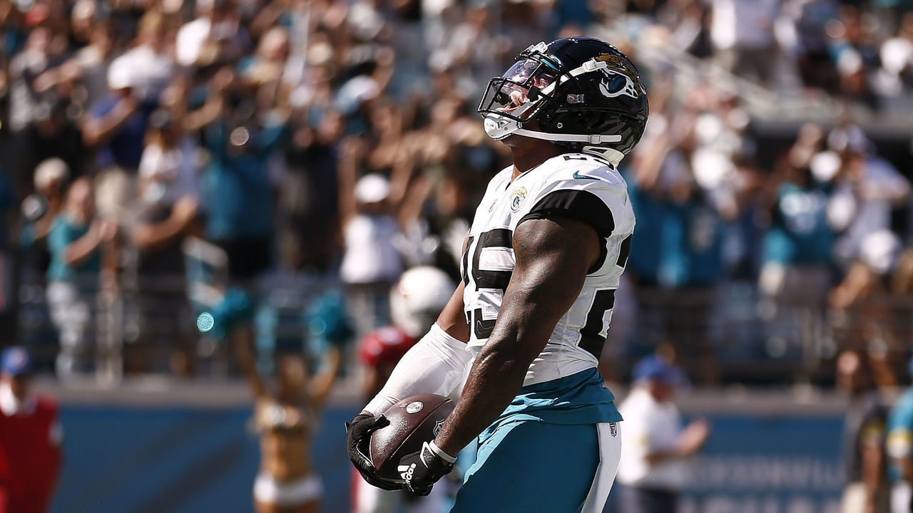 JACKSONVILLE, FLORIDA - SEPTEMBER 26: James Robinson #25 of the Jacksonville Jaguars celebrates after rushing for a touchdown during the second half against the Arizona Cardinals at TIAA Bank Field on September 26, 2021 in Jacksonville, Florida.