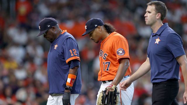 HOUSTON, TEXAS - OCTOBER 16: Luis Garcia #77 of the Houston Astros is taken out of the game due to an injury in the second inning of Game Two of the American League Championship Series against the Boston Red Sox at Minute Maid Park on October 16, 2021 in Houston, Texas.