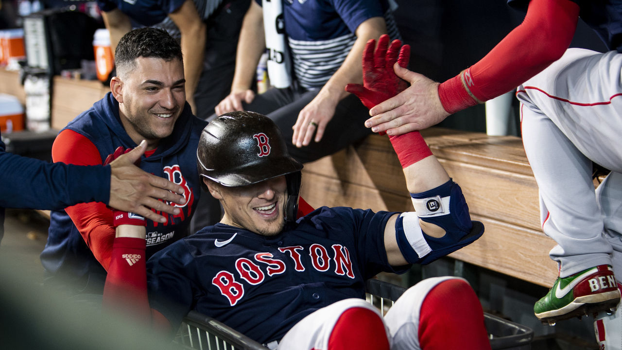 HOUSTON, TX - OCTOBER 16: Enrique Hernandez #5 of the Boston Red Sox is pushed in a laundry cart by Jose Iglesias #12 after hitting a solo home run during the fourth inning of game two of the 2021 American League Championship Series against the Houston Astros at Minute Maid Park on October 16, 2021 in Houston, Texas.