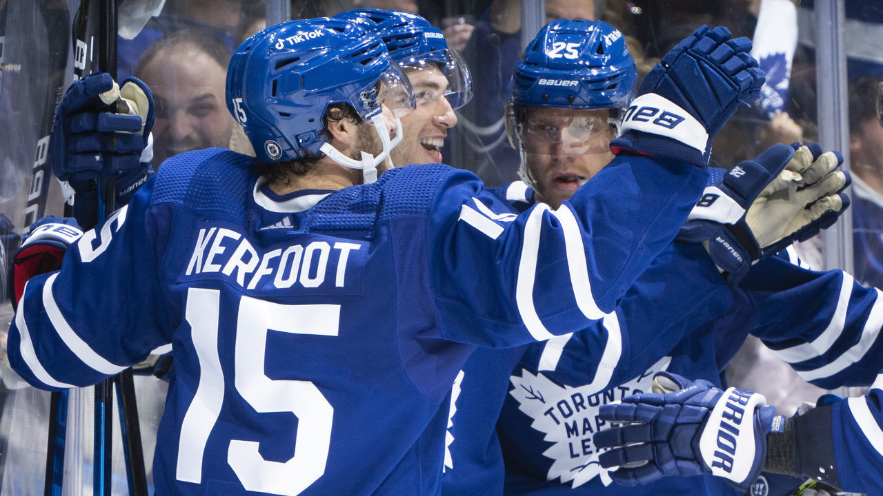 TORONTO, ON - OCTOBER 16: Michael Bunting #58 of the Toronto Maple Leafs celebrates with teammates Alexander Kerfoot #15 and Ondrej Kase #25 after scoring against the Ottawa Senators during the third period at the Scotiabank Arena on October 16, 2021 in Toronto, Ontario, Canada.