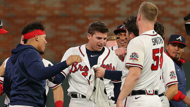ATLANTA, GEORGIA - OCTOBER 16: Austin Riley #27 of the Atlanta Braves celebrates after hitting a walk-off single against the Los Angeles Dodgers during the ninth inning of Game One of the National League Championship Series at Truist Park on October 16, 2021 in Atlanta, Georgia.