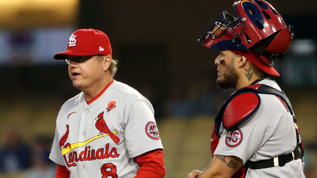 LOS ANGELES, CALIFORNIA - MAY 31: Manager Mike Shildt #8 and Yadier Molina #4 of the St. Louis Cardinals stand on the mound during a pitching change during the sixth inning against the Los Angeles Dodgers at Dodger Stadium on May 31, 2021 in Los Angeles, California.