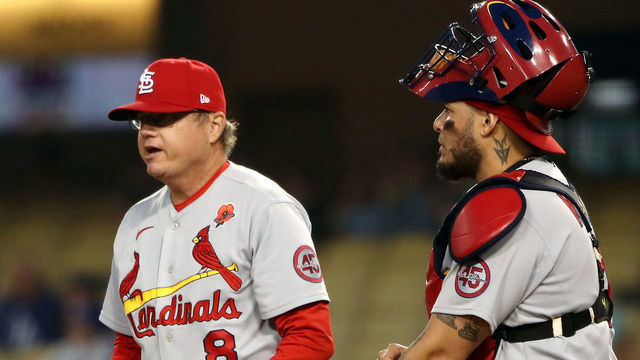 LOS ANGELES, CALIFORNIA - MAY 31: Manager Mike Shildt #8 and Yadier Molina #4 of the St. Louis Cardinals stand on the mound during a pitching change during the sixth inning against the Los Angeles Dodgers at Dodger Stadium on May 31, 2021 in Los Angeles, California.