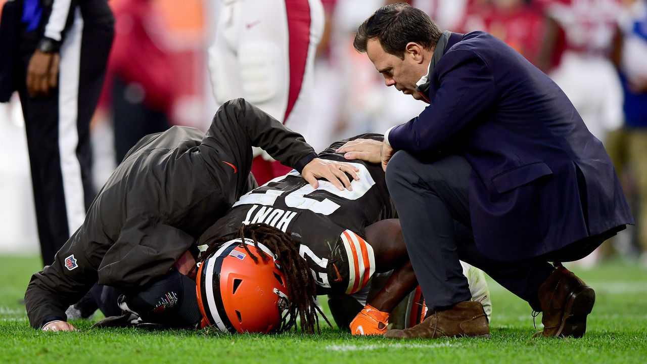 CLEVELAND, OHIO - OCTOBER 17: Kareem Hunt #27 of the Cleveland Browns is tended to by team medical personnel after an injury during the fourth quarter against the Arizona Cardinals at FirstEnergy Stadium on October 17, 2021 in Cleveland, Ohio.