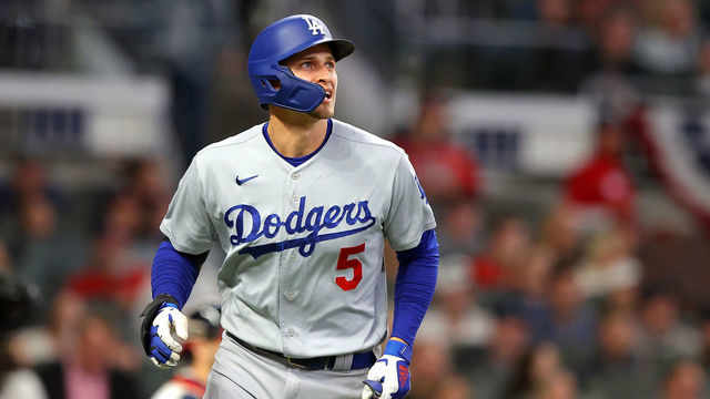 ATLANTA, GEORGIA - OCTOBER 17: Corey Seager #5 of the Los Angeles Dodgers watches his two run home run go over the wall against the Atlanta Braves in the first inning of Game Two of the National League Championship Series at Truist Park on October 17, 2021 in Atlanta, Georgia.