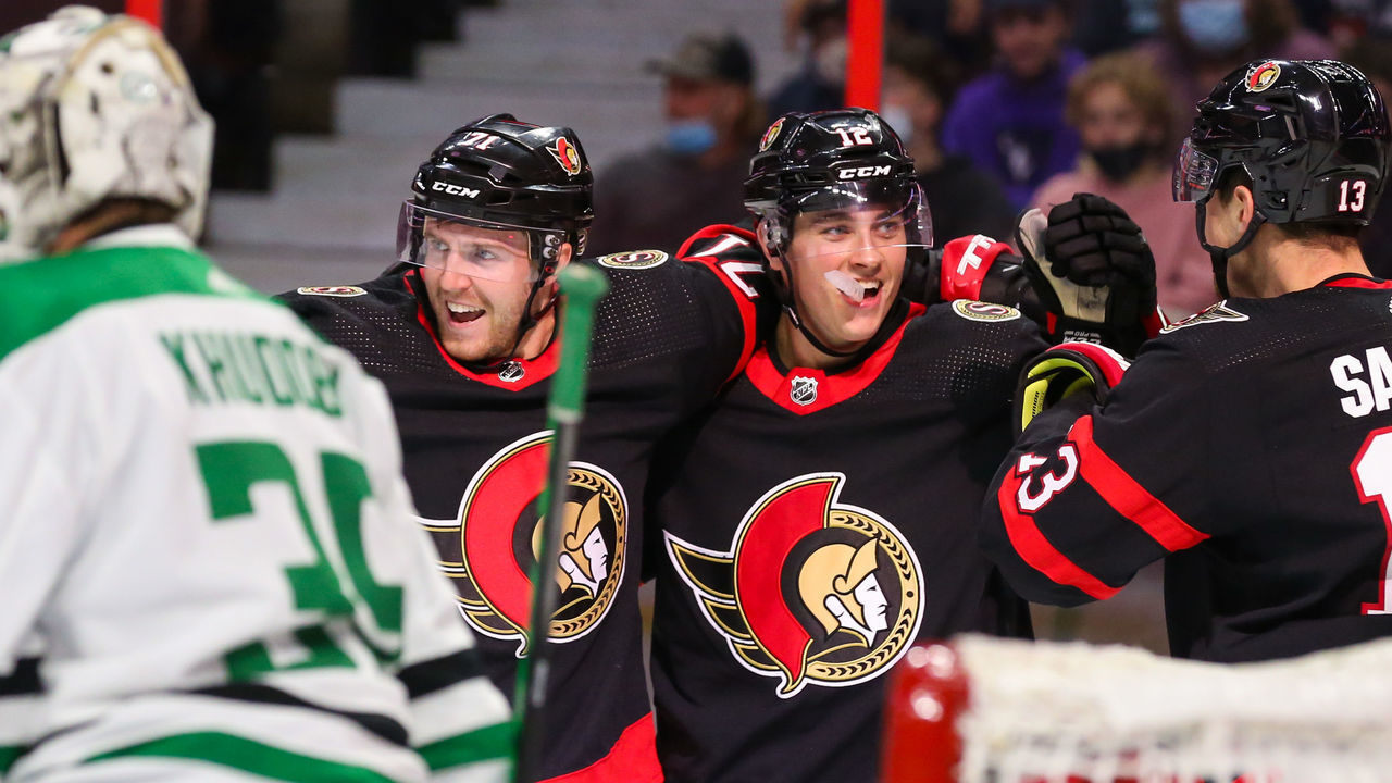 OTTAWA, ONTARIO - OCTOBER 17: Chris Tierney #71 of the Ottawa Senators celebrates his second period goal with Shane Pinto #12 and Zach Sanford #13 against the Dallas Stars at Canadian Tire Centre on October 17, 2021 in Ottawa, Ontario.