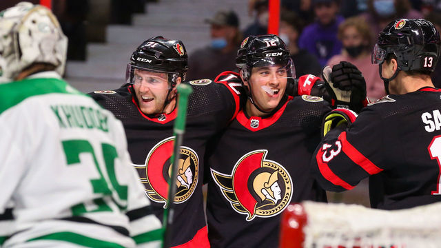OTTAWA, ONTARIO - OCTOBER 17: Chris Tierney #71 of the Ottawa Senators celebrates his second period goal with Shane Pinto #12 and Zach Sanford #13 against the Dallas Stars at Canadian Tire Centre on October 17, 2021 in Ottawa, Ontario.