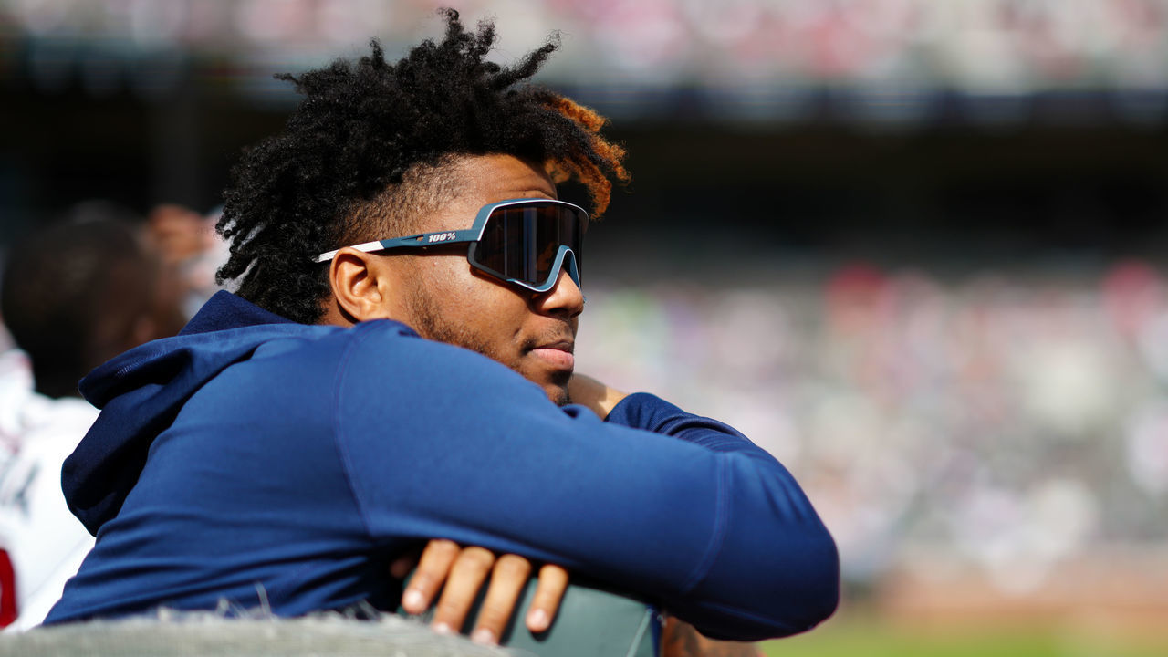 ATLANTA, GA - OCTOBER 11: Ronald Acuna Jr. #13 odf the Atlanta Braves is seen in the dugout during Game 3 of the NLDS between the Milwaukee Brewers and the Atlanta Braves at Truist Park on Monday, October 11, 2021 in Atlanta, Georgia.